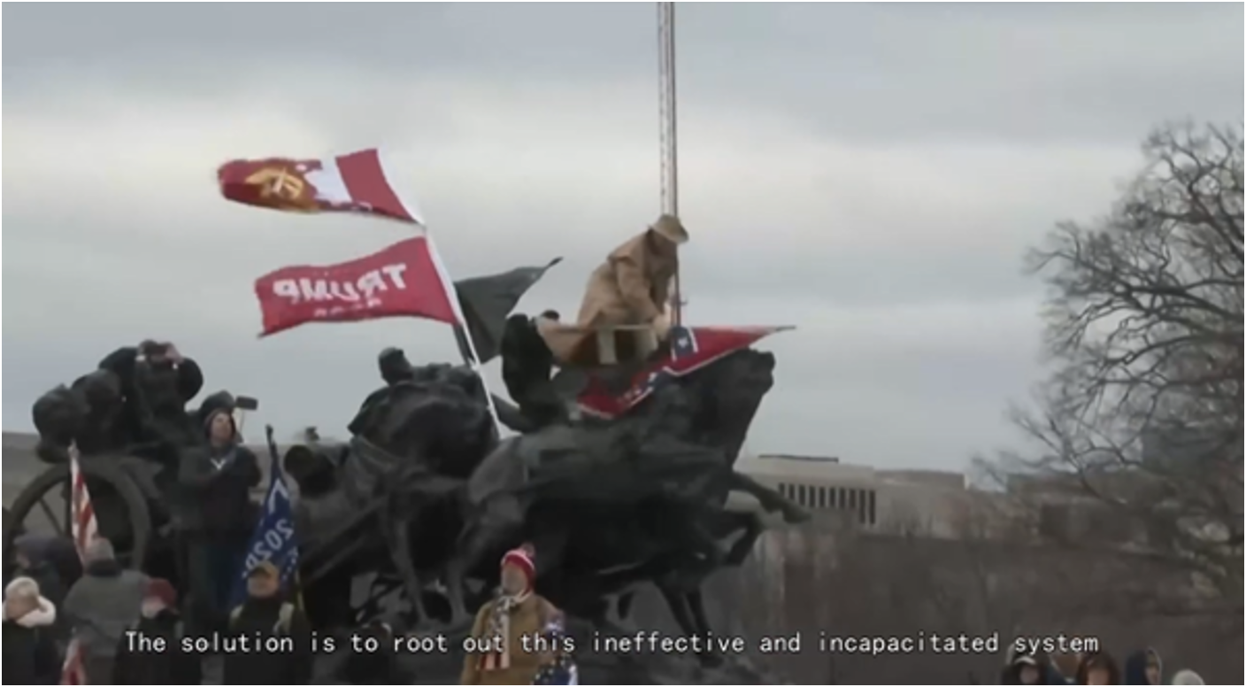 DRAGONBRIDGE video containing an image from the Jan. 6 Capitol riots and asserting that “the solution to America’s ills is not to vote for someone,” but rather “to root out this ineffective and incapacitated system”